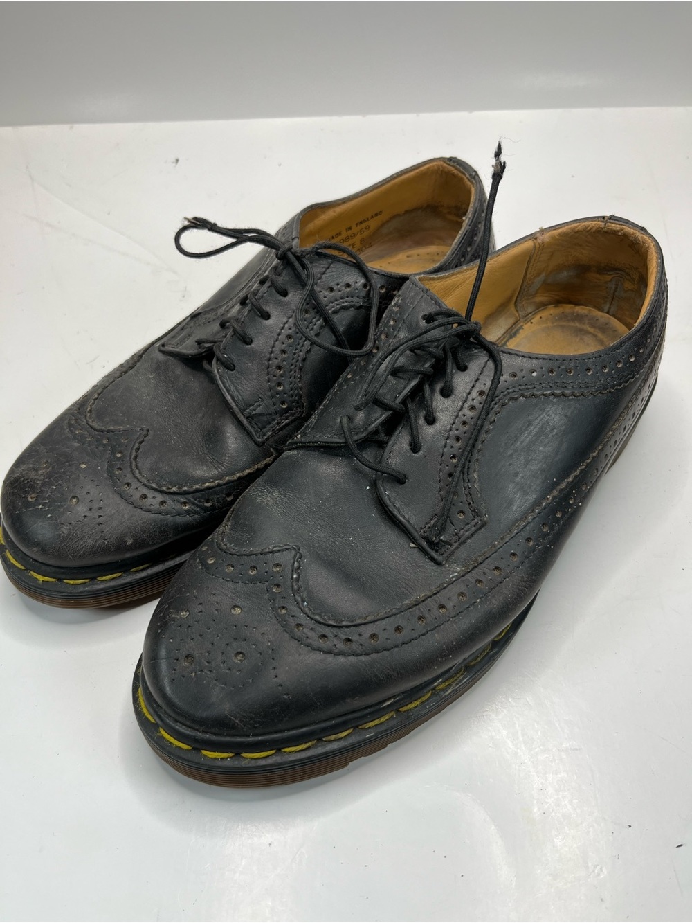 Dr. Martens Black Wingtip Brogue Oxfords with Yellow Welt Stitching